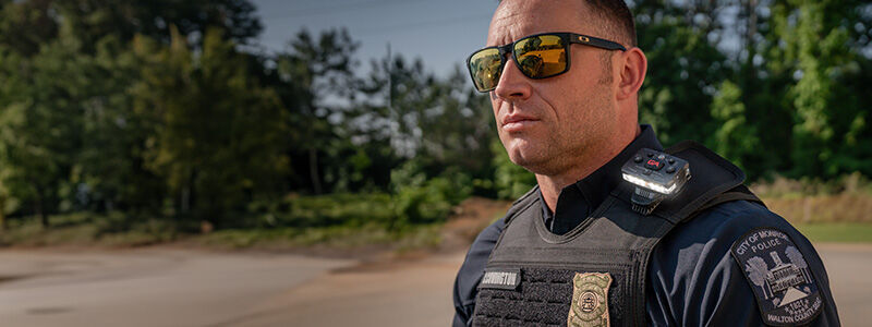 police officer with a guardian angel device mounted on their vest