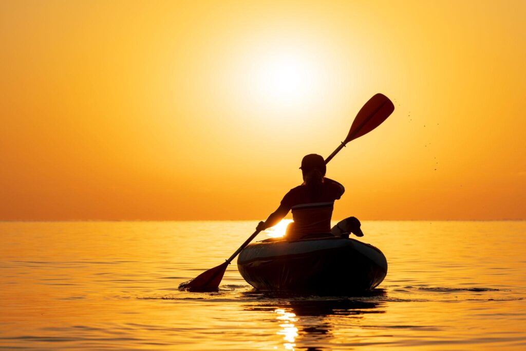 Kayaker kayaking just before dark