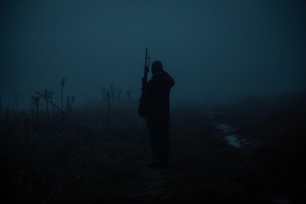 A hunter in foggy and dark conditions