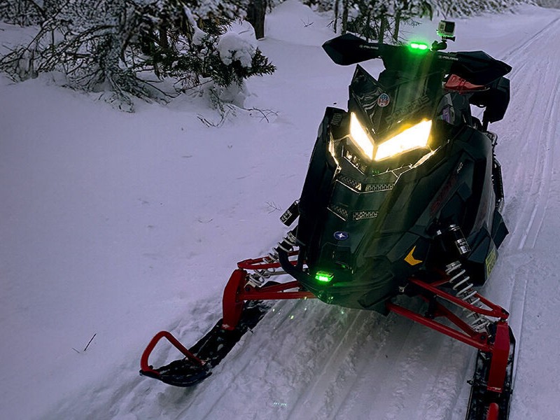 A snowmobile with a Guardian Angel Device on it